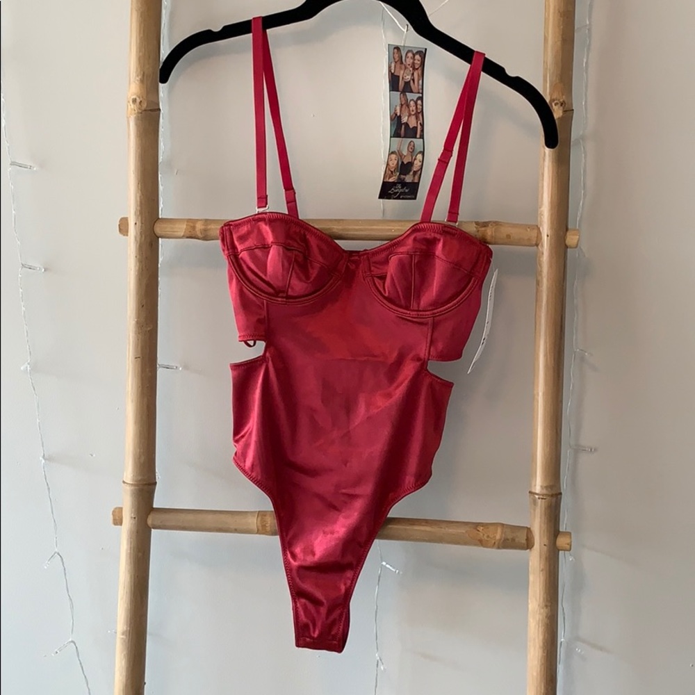 red metallic bodysuit. Never worn!